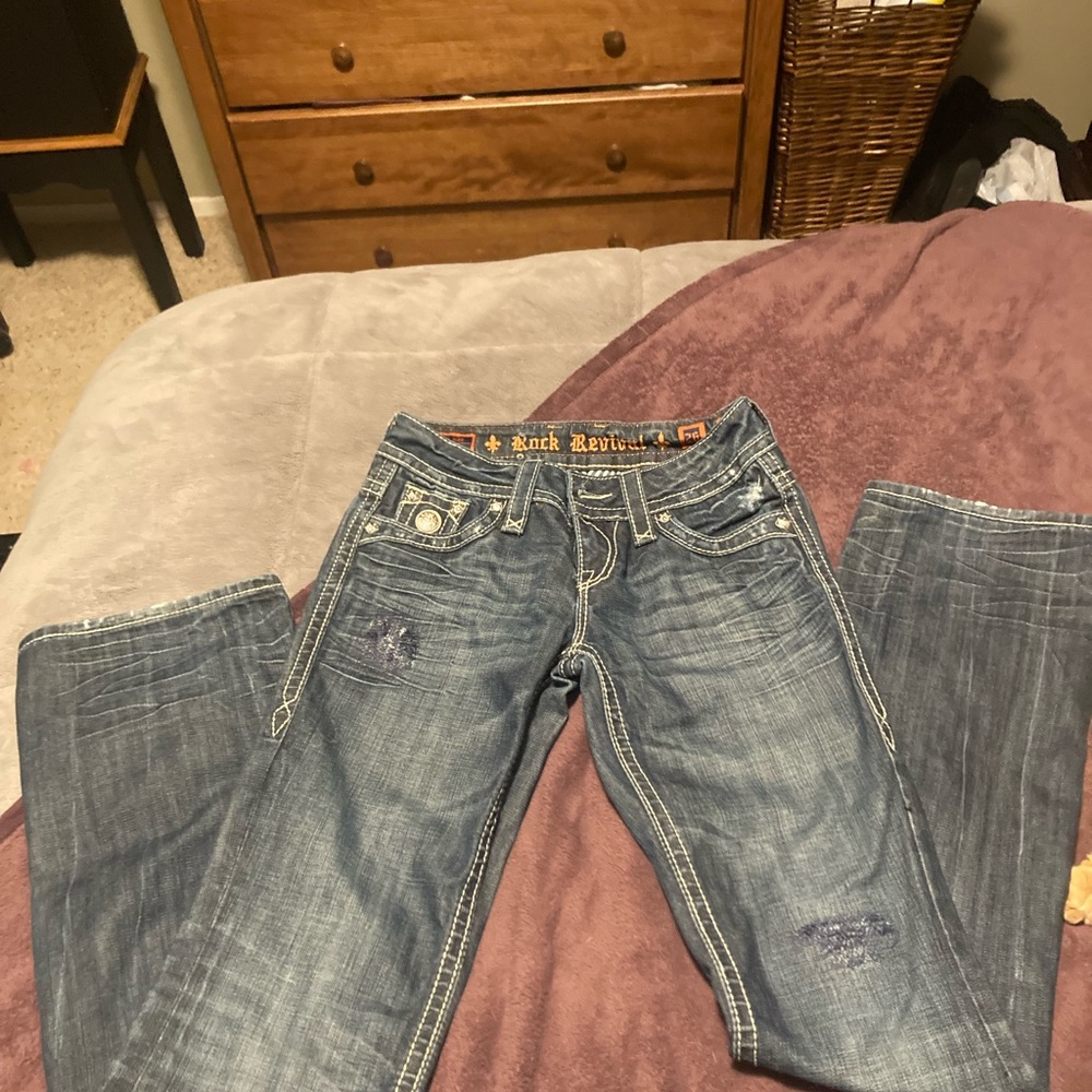 Rock Revival boot cut jeans  size 26 x 34 mid rise is 8 inches.